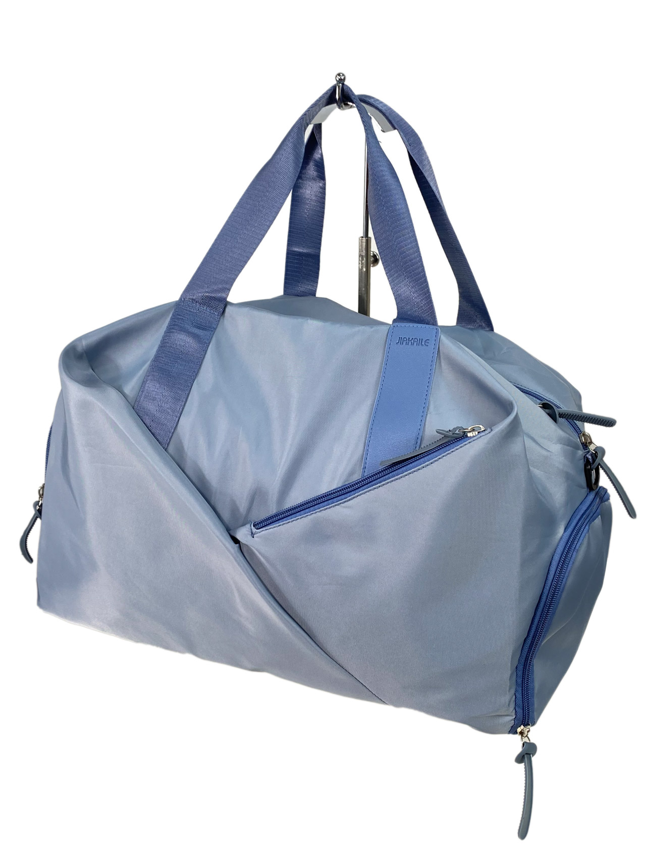На фото 1 - Дорожная сумка из текстиля, цвет голубой