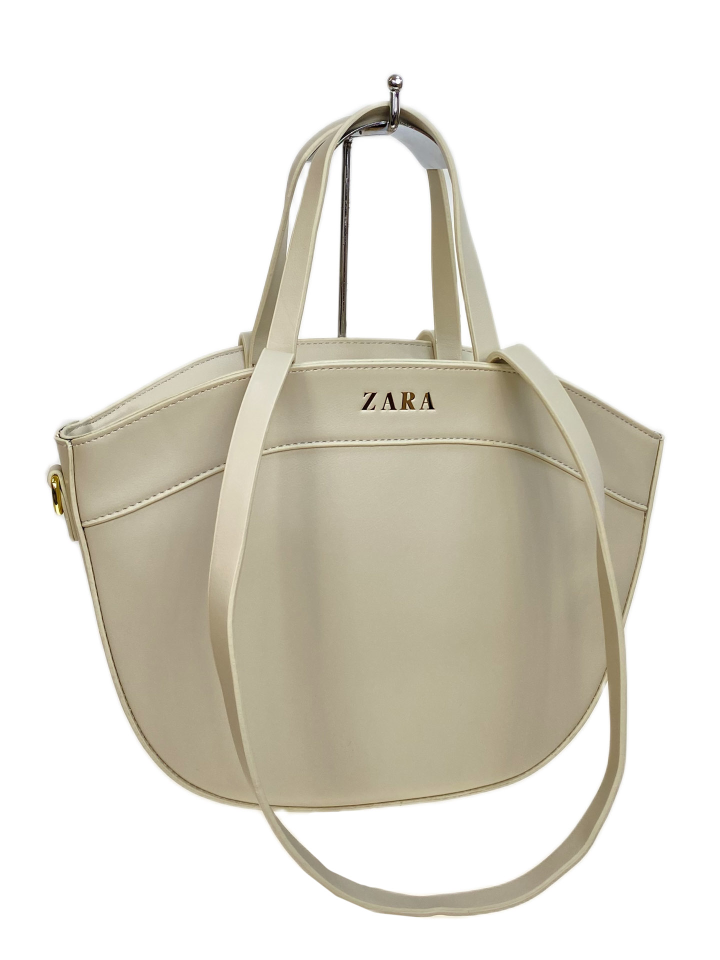 На фото 1 - Женская сумка из искусственной кожи, цвет молочный