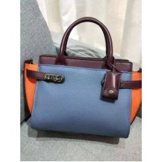 На фото 3 - Кожаная женская сумка-портфель, цвет синий с оранжевым и бордовым