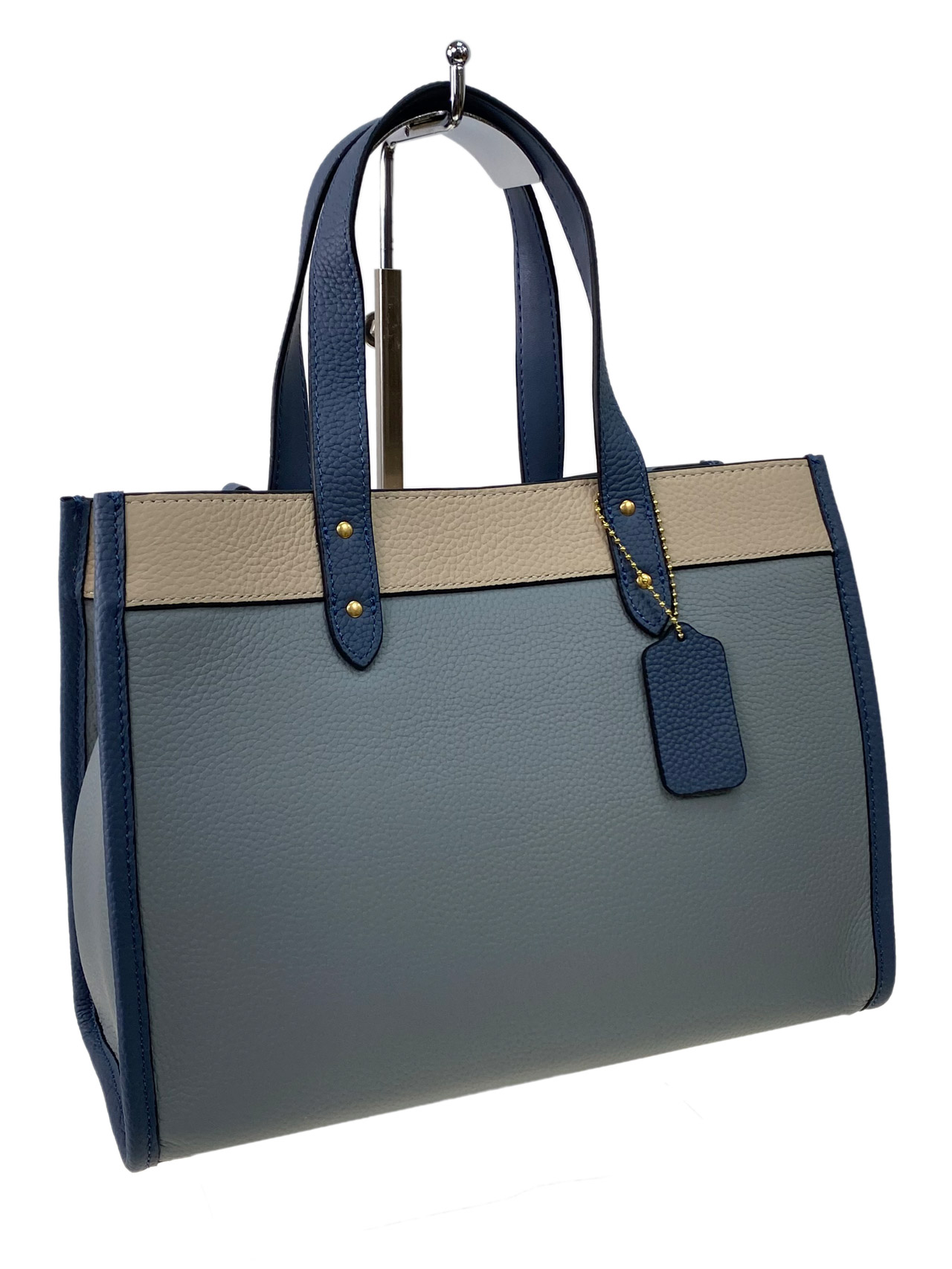 На фото 1 - Женская сумка  из натуральной кожи, цвет  голубой с молочным и синим