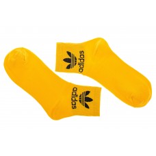 На фото 1 - Спортивные жёлтые носки с принтом