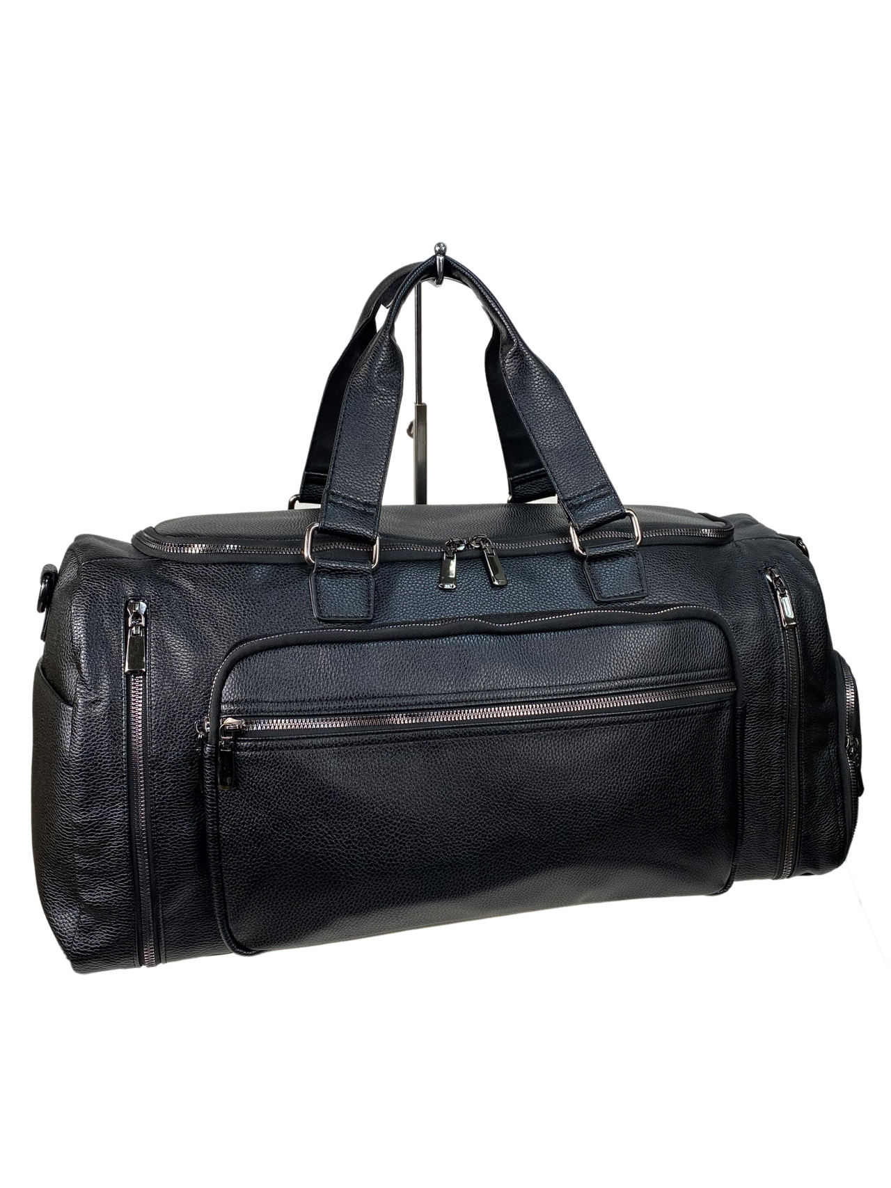 На фото 1 - Дорожная сумка из искусственной кожи, цвет черный